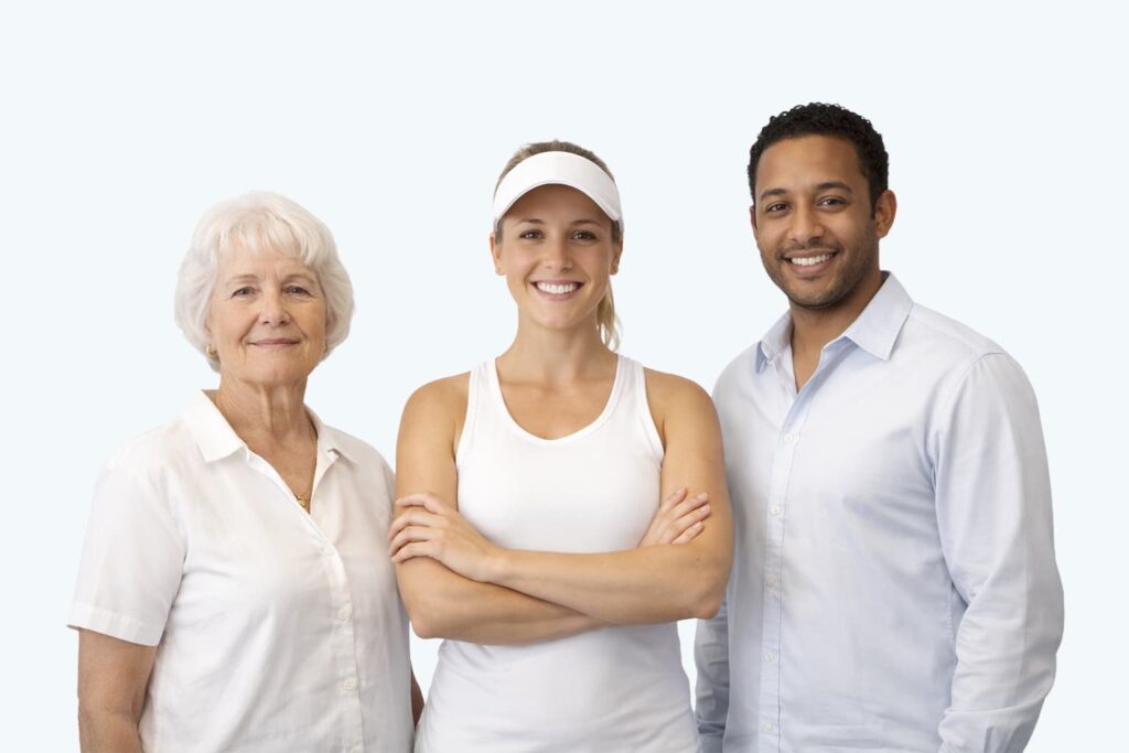 Smiling woman in athletic wear with two individuals, one older and one younger, all standing confidently together.