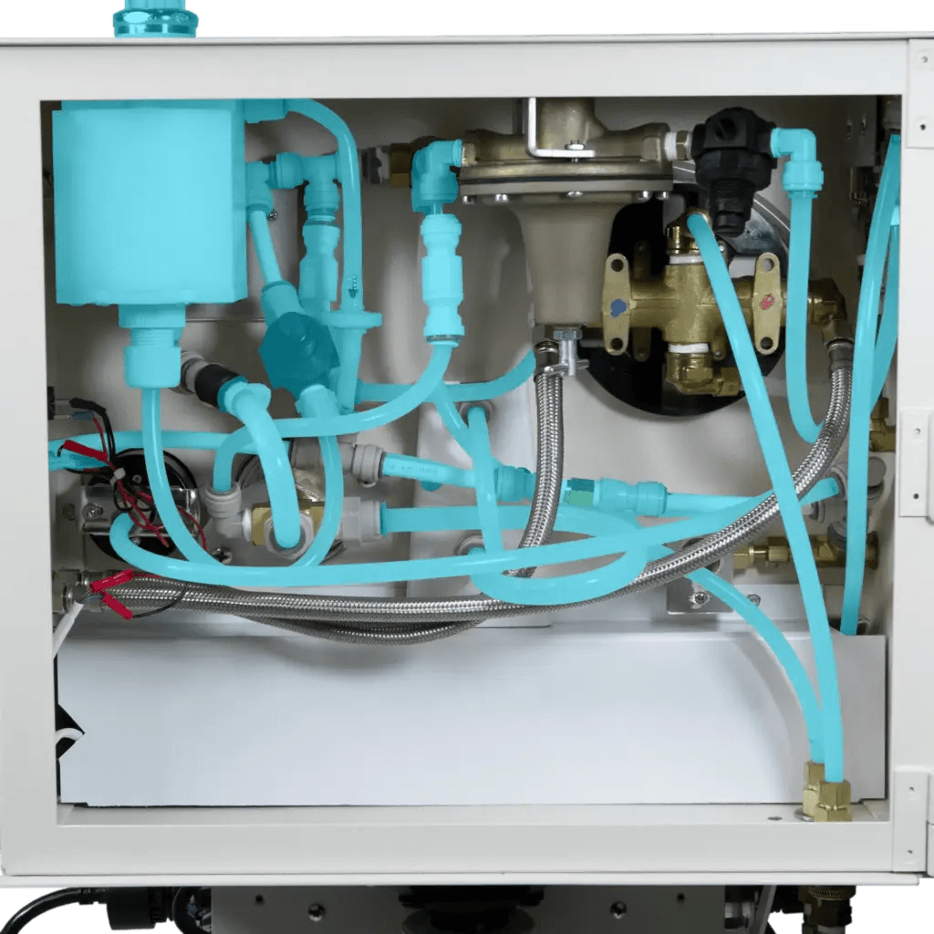 Complex network of blue tubing and valves inside a mechanical unit, showcasing plumbing and water system components.